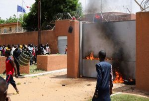Pro-junta demonstrators gathered outside the French embassy, try to set it on fire before being dispersed by Nigerien security forces in Niamey, the capital city of Niger July 30, 2023. REUTERS/Souleymane Ag Anara