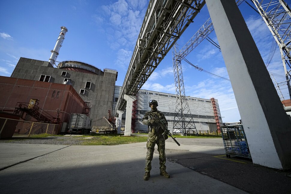A Russian serviceman guards an area of the Zaporizhzhia Nuclear Power Station, May 1, 2022, in a territory under Russian military control, in southeastern Ukraine