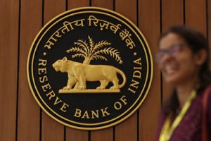 A woman walks past the Reserve Bank of India (RBI) logo inside its headquarters in Mumbai, India, April 6, 2023. REUTERS/Francis Mascarenhas/File Photo