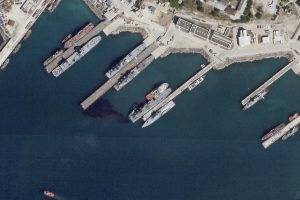A satellite photo appears to show the damaged Russian landing vessel Olenegorsky Gornyak leaking oil Friday while docked in Novorossiysk, Russia. Ukraine said its sea drones damaged the warship.Planet Labs PBC via AP